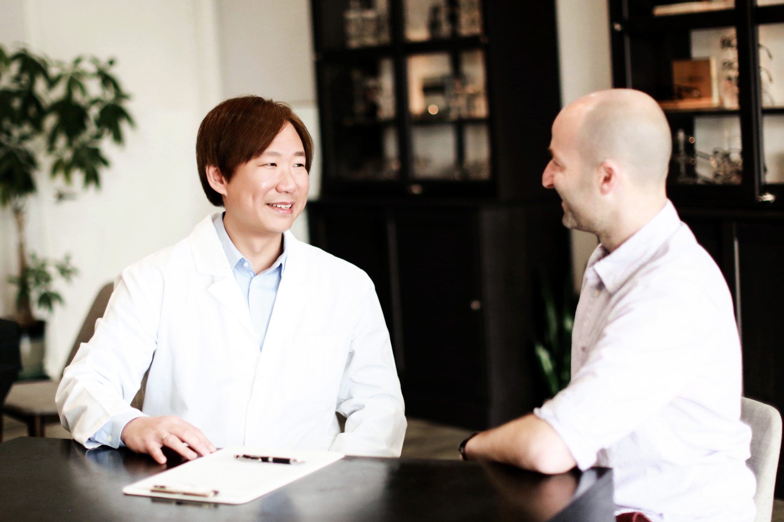 Dr. Thai Tran talking to a patient.